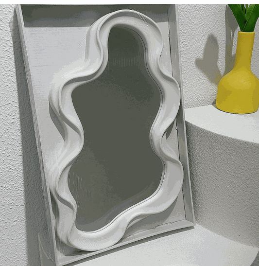 Cloud shaped makeup mirror with white ripple frame and aluminum lens in living room setting