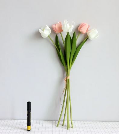 Artificial tulip room decoration with vibrant colors in a vase, adding elegant home decor.