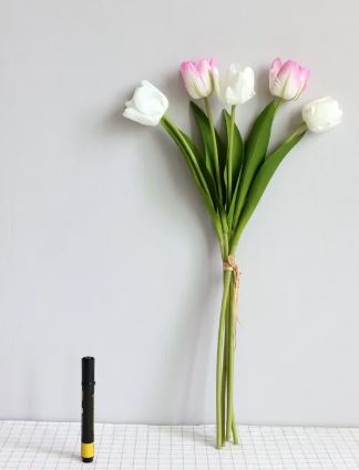 Artificial tulip room decoration with vibrant, lifelike flowers in a vase