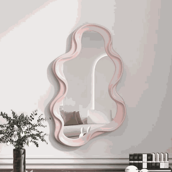 Cloud shaped makeup mirror with white ripple plastic frame and aluminum lens in living room setting