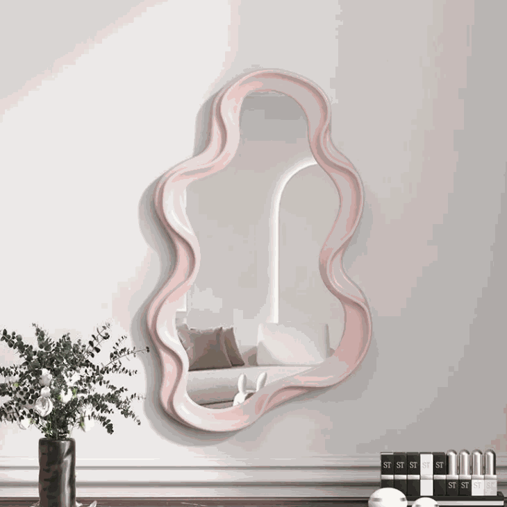 Cloud shaped makeup mirror with white ripple plastic frame and aluminum lens in living room setting