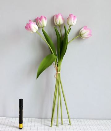 Artificial tulip room decoration with vibrant lifelike flowers in a vase