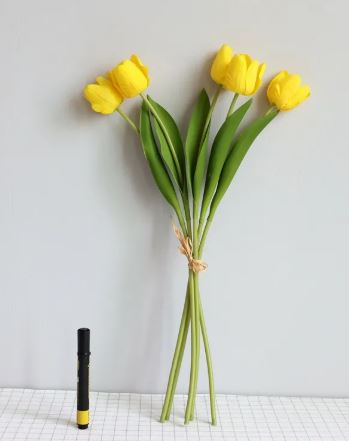 Artificial tulip room decoration with vibrant colors and realistic textures in a vase